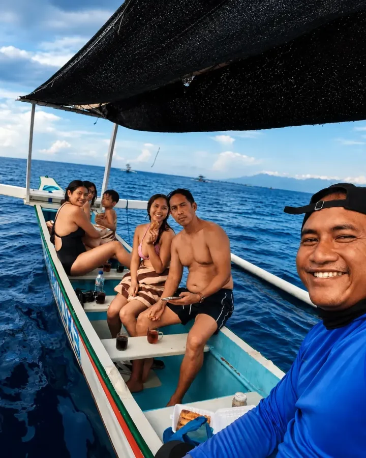 Guests on a private dolphin watching trip in Lovina, Bali