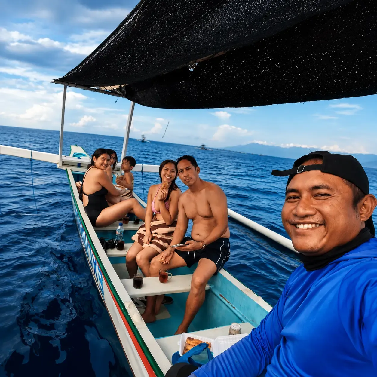 Guests on a private dolphin watching trip in Lovina, Bali
